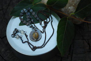 Coin pendant necklace with teardrop rutilated quartz gemstone