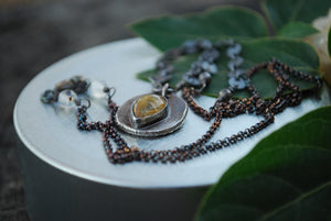 Coin pendant necklace with teardrop rutilated quartz gemstone