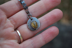 Coin pendant necklace with teardrop rutilated quartz gemstone